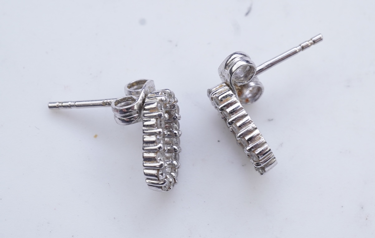 A diamond pendant and pair of diamond stud earrings